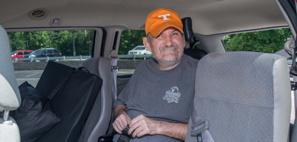 Supported-Living-Header Smiling Patient in Van